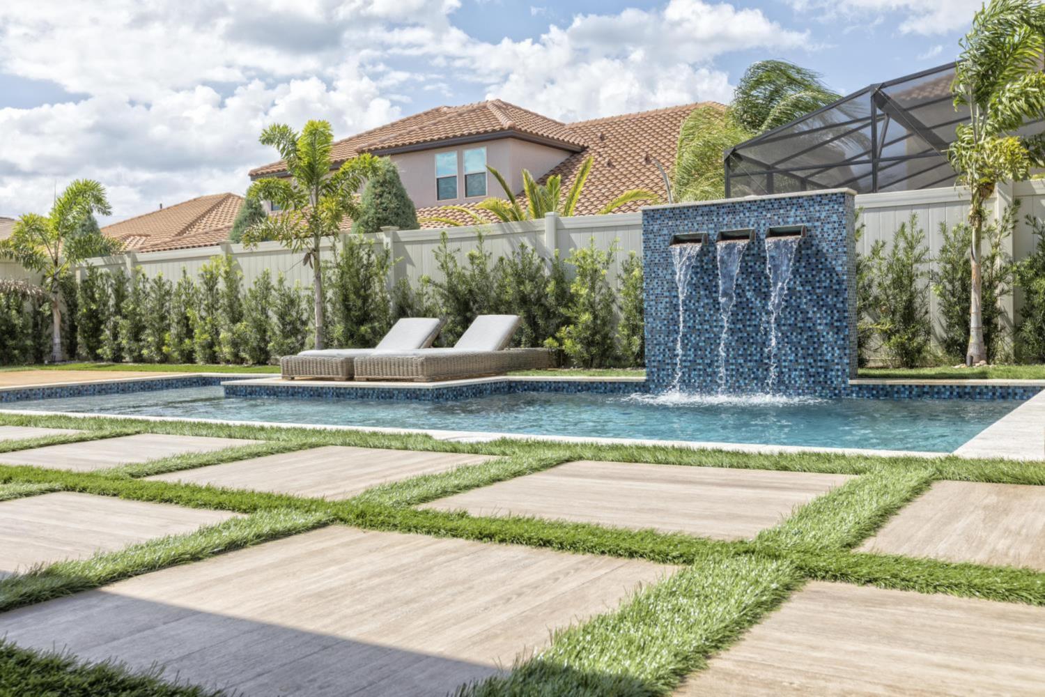 Beautiful backyard pool with water features